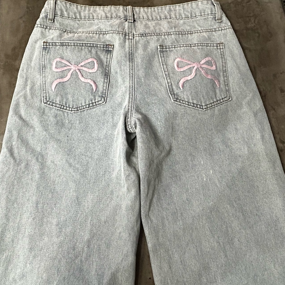 Edikted jeans with embroidered bow (light pink) detail on back pockets
